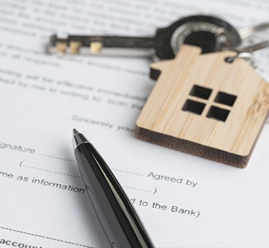 key with house keyring on document