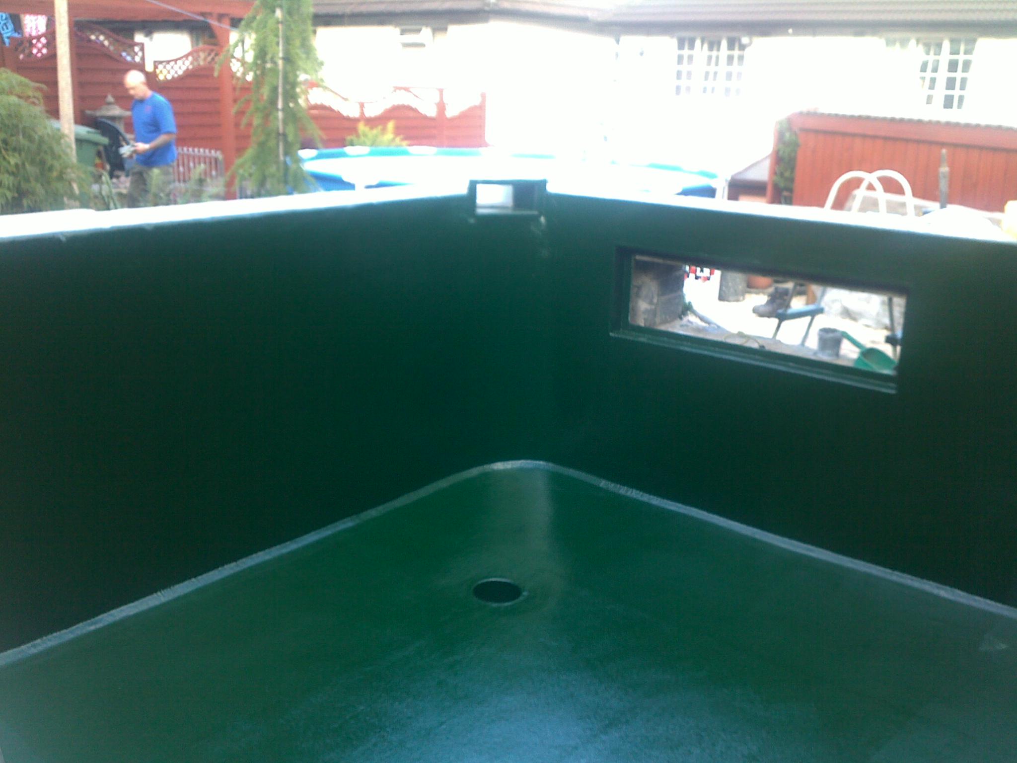 Fibreglass pond lining Cardiff with green flocoat.