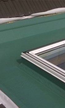 GRP Flat Roof in green with window.