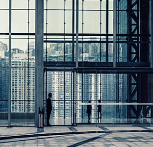 modern glass building with automatic doors