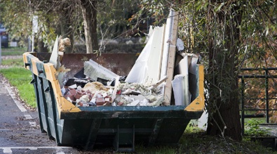skip filled with waste