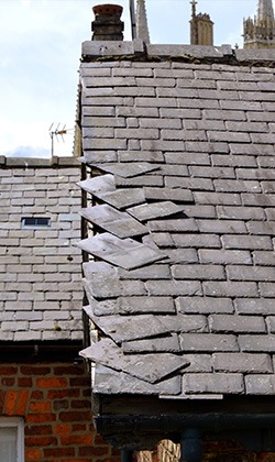 dislodged slates on a roof