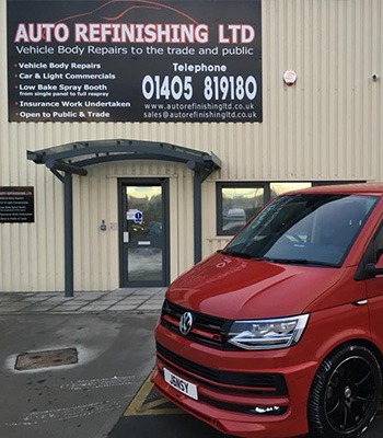 Car Body Repairs Doncaster - red resprayed transport van outside premises