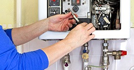 engineer installing a boiler