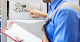 engineer inspecting a boiler