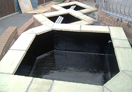 3 small black fibreglass pond linings in a row.