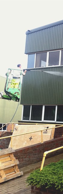 Mobile Platform Hire Near Me: cleaning cladding on a cherry picker
