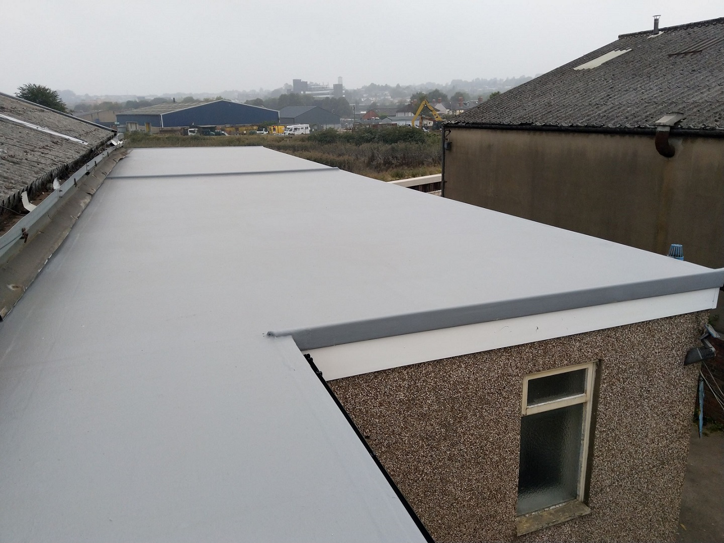 Flat roof in Newport finished in light grey flocoat.