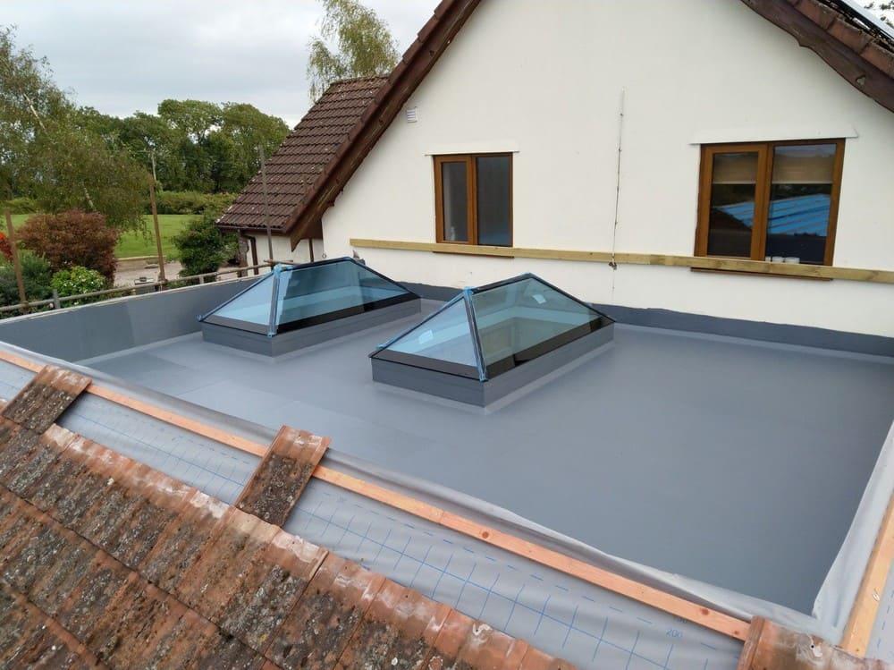 Fibreglass flat roof in Chepstow with 2 lantern skylights.