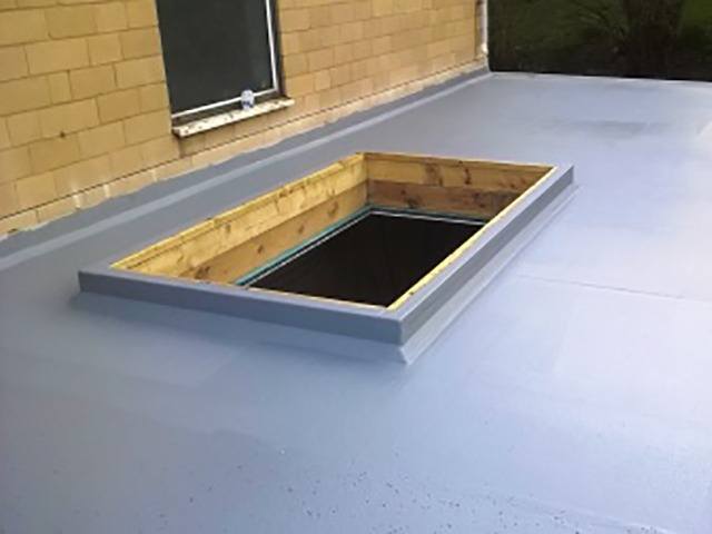 Fibreglass flat roof with large opening for lantern or skylight.