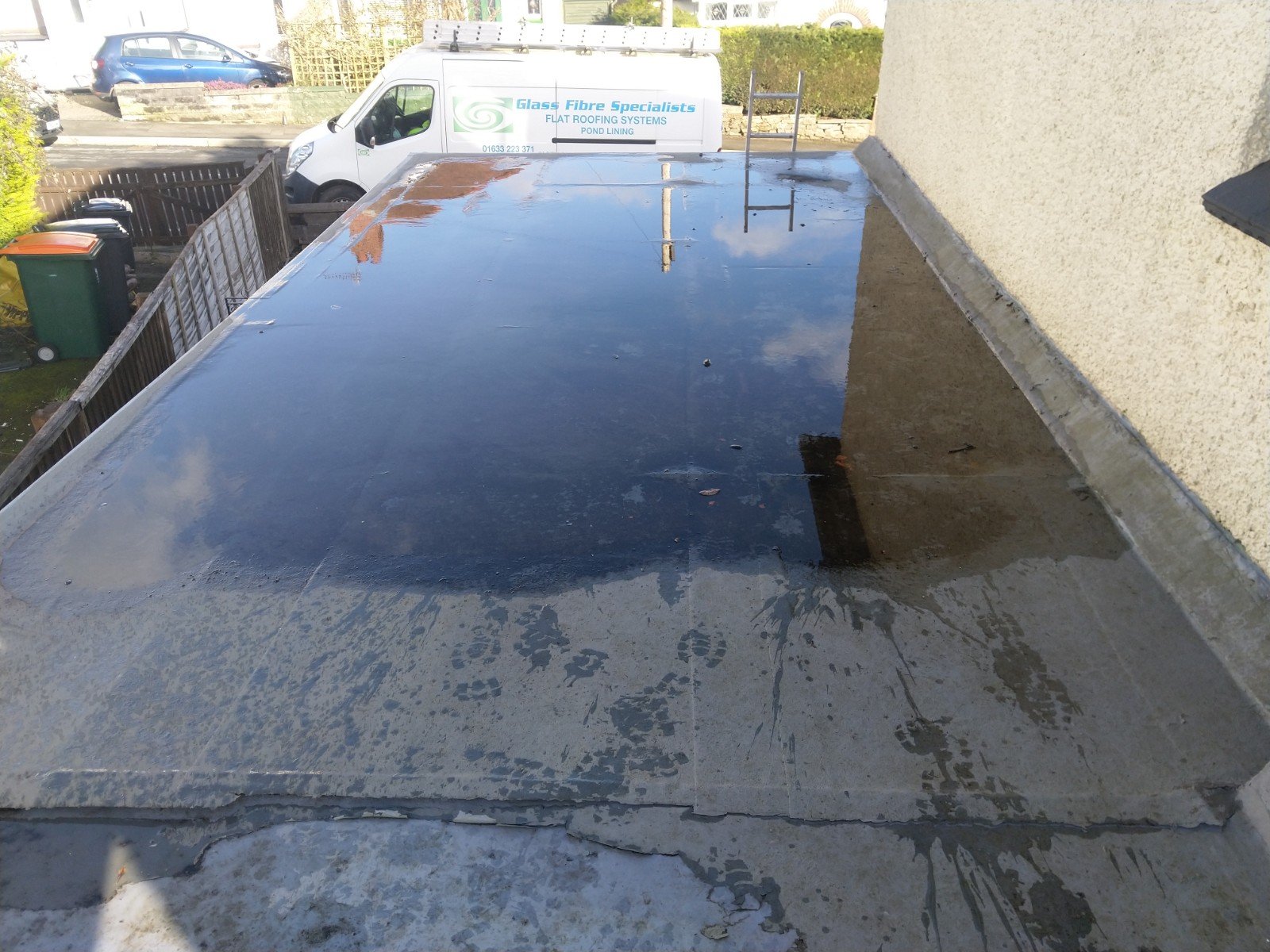 Flat roof in Newport with lots of pooling water.