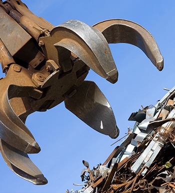 crane grabbing and sorting scrap