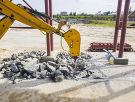 A yellow concrete breaker