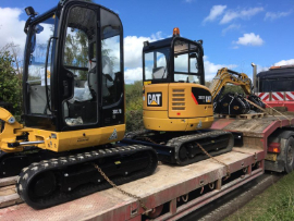 Image of excavators on a trailer