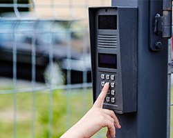 pressing buttons on an intercom