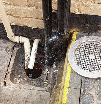 down pipes leading down to a drain