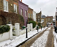 terraced homes with snowy roads