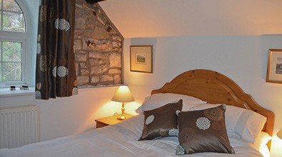 master bedroom in riverside cottage
