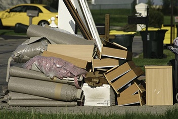 large amounts of bulky cabinets and carpet waste