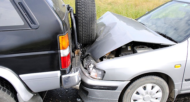 2 crashed cars on side of road