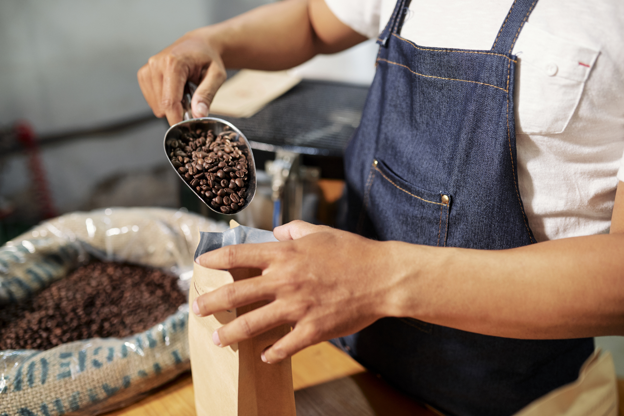 Coffee beans being packed into a bag