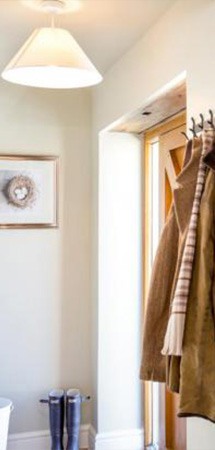 doorway with coat rack in view