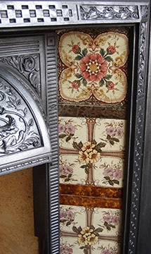 decorative tiles and cast iron fireplace