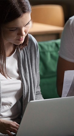 young business owner working out her accounts