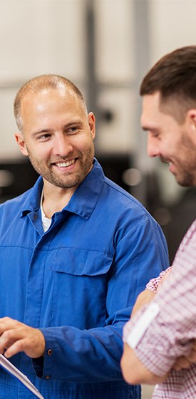mechanic explaining to customer