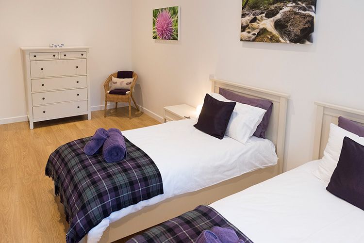 twin bedroom with beds made neatly