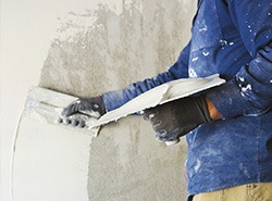 plasterer preparing a wall